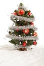 Small decorative christmas tree in artificial snow