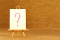 Small decorative easel with question mark, copy space and editable. Illustration of creative crisis Royalty Free Stock Photo