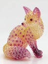 Sparkling Fox Figurine With Pink And Yellow Gems Sitting White Background Studio Lighting Royalty Free Stock Photo