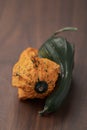 small decorative funny shaped pumkin on wood table