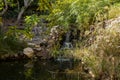 A small decorative pond with a decorative waterfall on display at the Botanical Garden in Eilat city, southern Israel