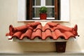 Small decorative roof below the window Royalty Free Stock Photo