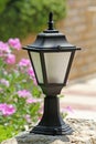 Small decorative street lamp in the yard Royalty Free Stock Photo