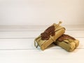 Small delivery box tied with twine with a wax seal on wooden boards