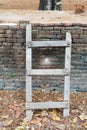 Small diagonal wooden ladder Royalty Free Stock Photo