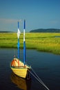 A small dinghy floats on the Essex River in Massachusetts