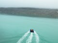 A small dinghy in front in the arctic ocean Royalty Free Stock Photo