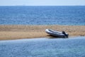 Small dinghy at a lonely beach.