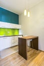 Small dining space in green kitchen