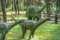 Small diplodocus dinosaurs statues