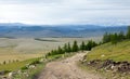 Dirt Road through northern Mongolia Mountains Royalty Free Stock Photo