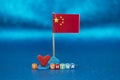 Small display of china flag with love symbol and colorful letters representing affection and identity in a creative setting Royalty Free Stock Photo