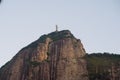 Small and distante chist the redeemer statue in corcovado mounta Royalty Free Stock Photo