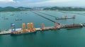 small distribution port in sea and pedestrian bridge to conect between islands and oil tankers ship floating in sea