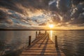 Small Dock at the lake water at sunset landscape, seascape sunrise Royalty Free Stock Photo