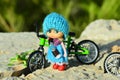 Small doll and bike Royalty Free Stock Photo
