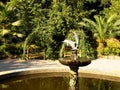 A small dolphin-shaped fountain in the park. Batumi, Georgia