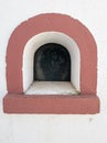 small domed window on the facade of the bullring in the village of Coruche.