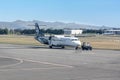 A small domestic Air New Zealand plane on the runway at Christchurch International Airport Royalty Free Stock Photo