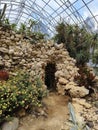 small door to an artificial cave in the greenhouse cactus garden