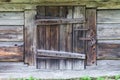 Small door to wooden log cabin