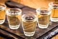 Small dose glasses, high quality distilled alcohol. Brazilian cachaÃÂ§a called pinga, drip, vodka, white rum, spirits, ozo, sake Royalty Free Stock Photo