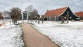 Small drawbridge and wooden houses in an old Dutch village Royalty Free Stock Photo