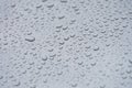 Small droplets of water on a matte gray background