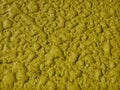 Small drops of rain water spread on the surface of the yellow floor Royalty Free Stock Photo