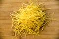 Small dry pasta noodles on wood background Royalty Free Stock Photo