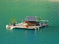 A small duck lodge on a artifical lake Ganglesee or Gaenglesee and in the Saminatal alpine valley - Steg, Liechtenstei