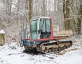 Small Dumper Tracked Truck with Muddy Chassis. The transporter waiting