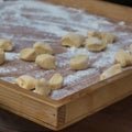 Small Dumplings on Wooden Board with Flour: Italian Gnocchi Pasta Royalty Free Stock Photo