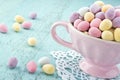 Small easter eggs in a pink cup
