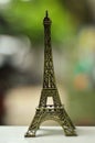 Small Eiffel Tower souvenir with bokeh background Royalty Free Stock Photo