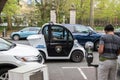 A small electric smart car Gem made by Polaris is seen being used as a parking enforcement vehicle by a Princeton Police Officer Royalty Free Stock Photo