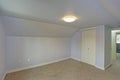 Small empty blue bedroom accented with vaulted ceiling