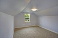 Small empty blue bedroom accented with vaulted ceiling Royalty Free Stock Photo