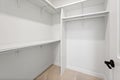 Small, empty closet with a black door Royalty Free Stock Photo