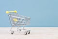 Small empty shopping cart on a table