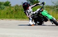 Small engine speed bike rider practice run on asphalt track in rural area Hungary