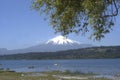 small eruption of the villarica volcano, in pucon city with lake ,chile Royalty Free Stock Photo