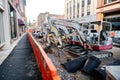 small excavator on a gravel road during street repair work in an urban environment Royalty Free Stock Photo