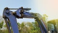 A small excavator is working to level the ground for a building Royalty Free Stock Photo