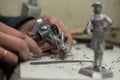 A small factory producing small batches pewter figurines.
