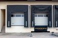 Small factory truck loading bay terminals front view daytime Royalty Free Stock Photo