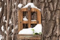 Small fairytale wooden house in a tree in a park in winter Royalty Free Stock Photo