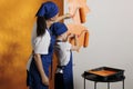 Small family painting walls with orange Royalty Free Stock Photo