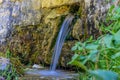 Small fantasy waterfall coming out from a wall