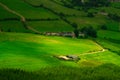 Small farm building and small road in county Tipperary, Ireland. Tilt shift and selective focus. Agricultural industry and food Royalty Free Stock Photo